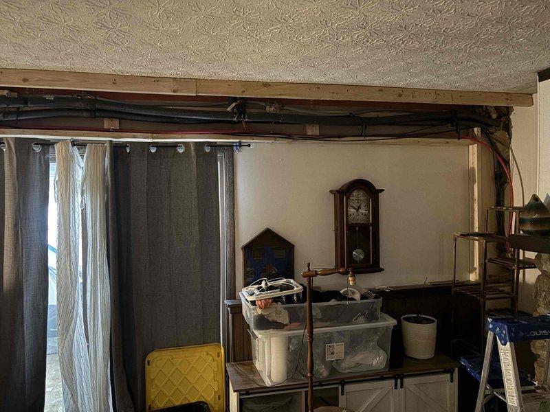 Attended property for scheduled combi boiler appointment. Inspected and serviced HVAC system pipes, ensuring proper insulation and connection integrity on the black insulated vertical pipes. Identified and secured a connection point that required additional wrapping with insulation material. Verified all mounting brackets were properly secured to the concrete block wall.