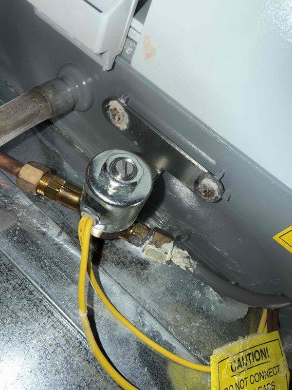 Responded to service call for a leaking humidifier on a 9-year-old furnace system. Inspected the plumbing connections and discovered mineral buildup at connection points causing the leak. Replaced damaged PVC drain piping and reconnected the system properly. Unit is now functioning correctly with no signs of leakage.