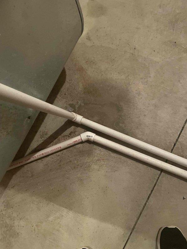 Responded to service call for a leaking humidifier on a 9-year-old furnace system. Inspected the plumbing connections and discovered mineral buildup at connection points causing the leak. Replaced damaged PVC drain piping and reconnected the system properly. Unit is now functioning correctly with no signs of leakage.