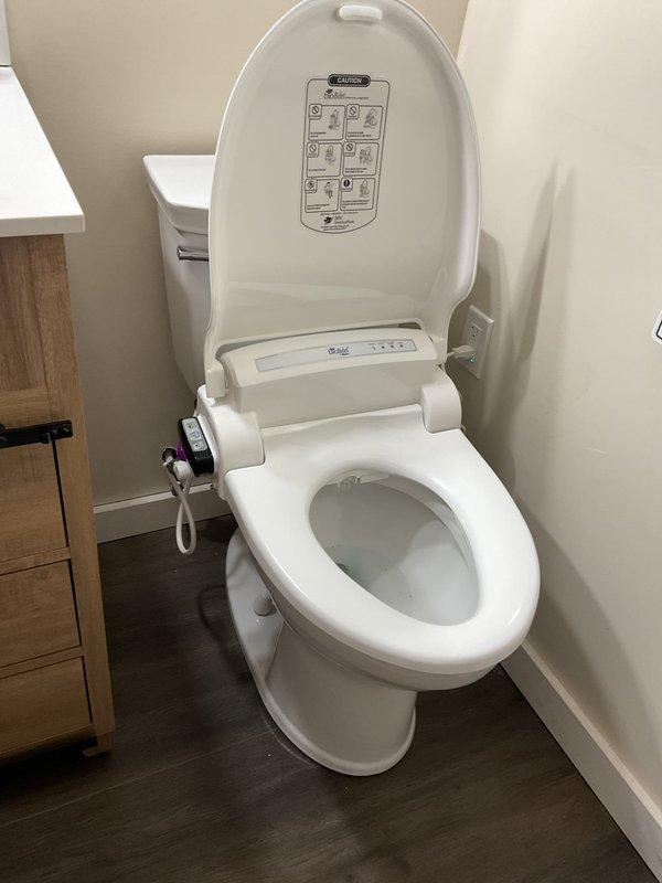 Completed toilet replacement in first floor bathroom, retaining customer's existing bidet seat and successfully transferring it to the new customer-supplied fixture. Also performed snaking of 3" horizontal drain from basement cleanout in high rough sewer system connected to septic, which required drilling access through cleanout cap to drain down system before servicing.