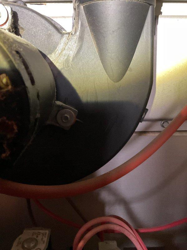 Diagnosed 25-year-old furnace with temperature regulation issues causing inconsistent heating cycles where temperature would drop into 60s before reactivation despite 70°F setpoint. Performed visual inspection of blower motor assembly and gas valve components, documenting condition with photos for assessment of system functionality.