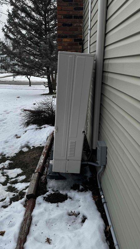 Responded to service call regarding leaning PCB on outdoor mini split unit. Upon inspection of the Mitsubishi Zubadan system, confirmed the unit was improperly mounted on concrete blocks with inadequate support, causing it to lean. Repositioned and leveled the outdoor unit, ensuring proper alignment for optimal performance and to prevent potential damage to internal components.