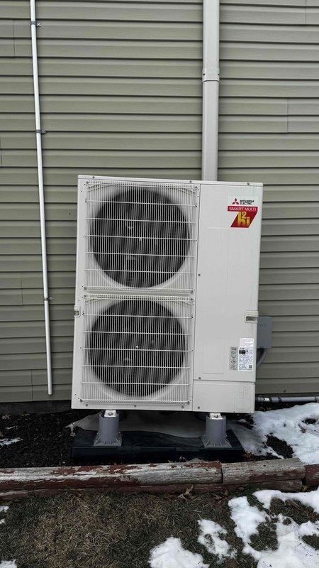 Responded to service call regarding leaning PCB on outdoor mini split unit. Upon inspection of the Mitsubishi Zubadan system, confirmed the unit was improperly mounted on concrete blocks with inadequate support, causing it to lean. Repositioned and leveled the outdoor unit, ensuring proper alignment for optimal performance and to prevent potential damage to internal components.