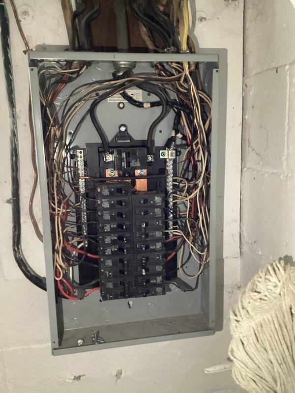 Diagnosed and repaired power outage affecting one side of residential wall in 86-year-old home. Inspection of the older circuit breaker panel revealed faulty connections and deteriorated wiring, which were causing intermittent power loss. Replaced damaged wiring, secured loose connections, and reorganized panel to restore complete electrical functionality to the affected area.