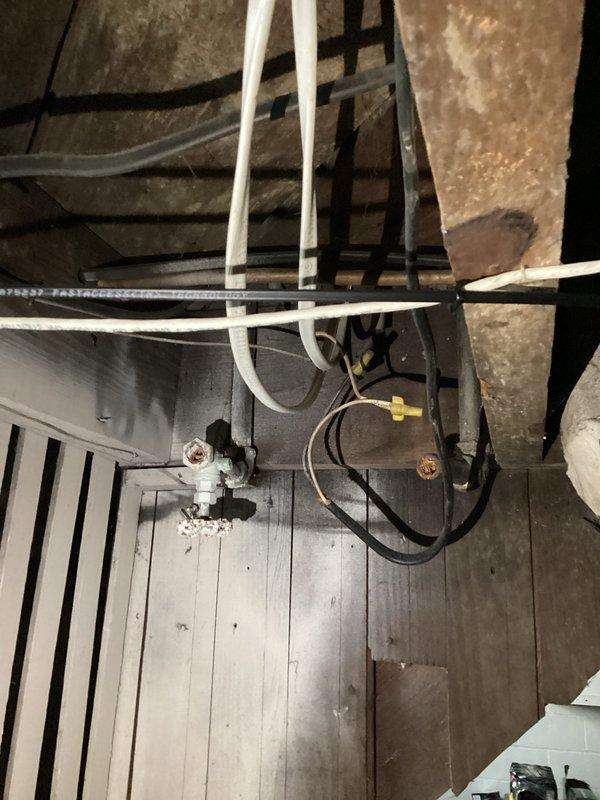 Diagnosed and repaired power outage affecting one side of residential wall in 86-year-old home. Inspection of the older circuit breaker panel revealed faulty connections and deteriorated wiring, which were causing intermittent power loss. Replaced damaged wiring, secured loose connections, and reorganized panel to restore complete electrical functionality to the affected area.