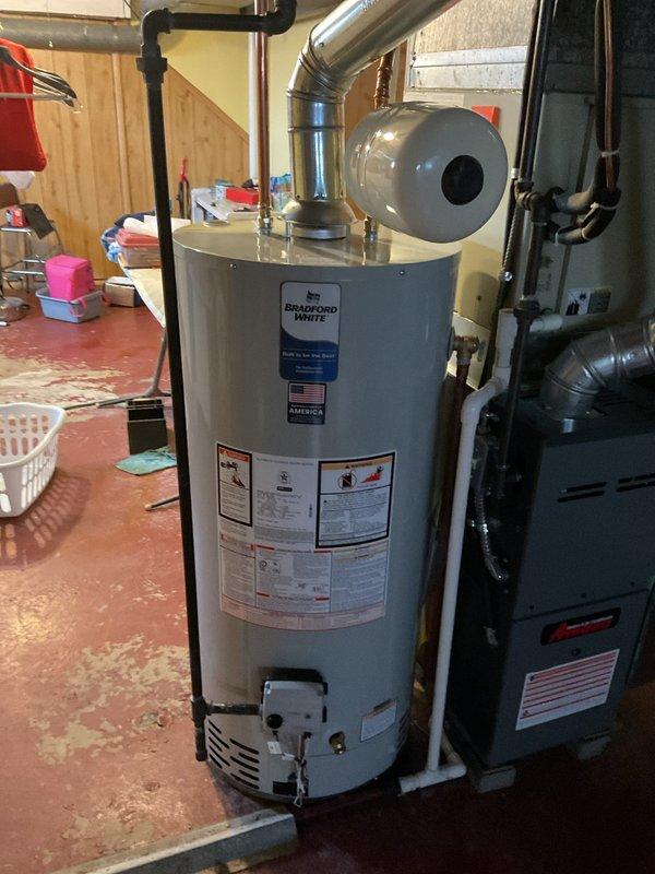 Responded to service call for a potential main drain backup causing basement flooding. Upon inspection, found water pooled on basement floor with visible damage to flooring materials. Evaluated the area surrounding water heater and furnace systems to identify the source of the backup. Cleared the clogged drain to restore proper drainage function.