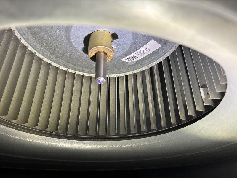 Performed scheduled MVP Heating maintenance service. Inspected blower wheel assembly and found components in good working condition with no visible damage or debris accumulation. Accessed interior components with service tool and examined ventilation system including perforated metal surfaces and sensor indicators. All systems functioning properly with no issues detected.