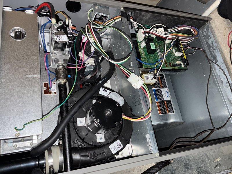 Responded to customer complaint of loud, potentially dangerous noise from furnace blower that began after recent hot water tank installation. Upon inspection of the 7-10 year old unit, removed access panels to examine blower assembly and internal components. Discovered foreign debris interfering with blower wheel operation, removed obstruction, and verified normal operation. System now functioning properly with no unusual noise.