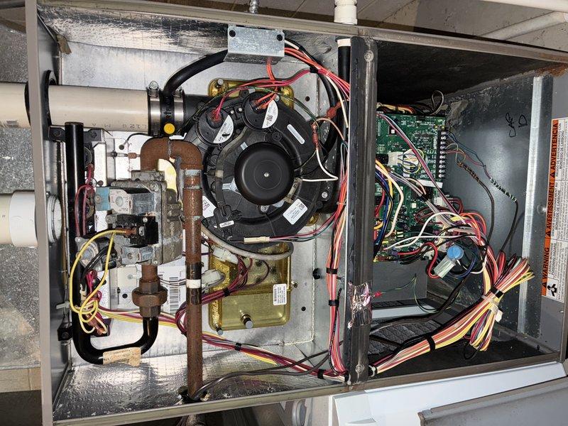 Diagnosed noisy furnace operation by inspecting blower assembly and performing electrical testing with multimeter. Found loose motor mount causing vibration; secured mounting hardware and verified proper voltage to motor. Unit now operating at normal noise levels with no further issues detected.