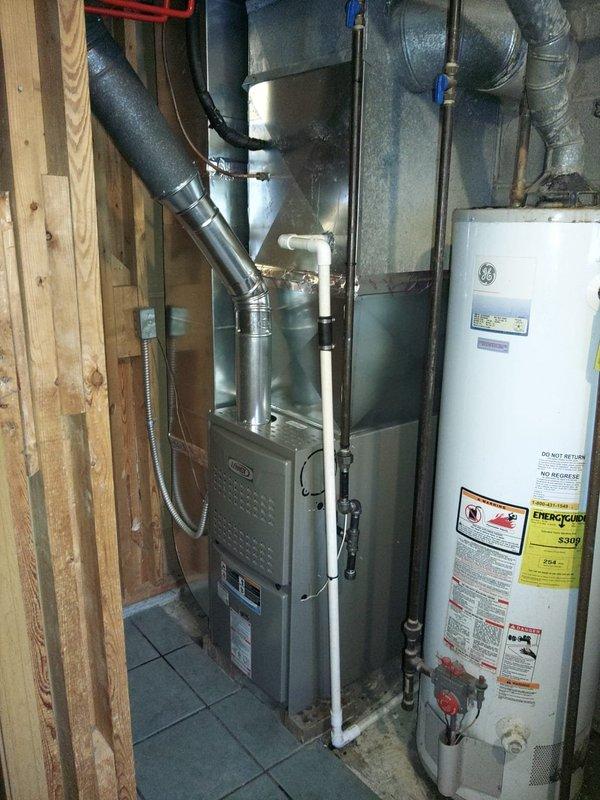 Completed installation of a new furnace system in residential mechanical room, including proper connection to existing ductwork. Installed Kidde carbon monoxide detector as safety measure and verified proper integration with water heater system. All components tested and confirmed operational.