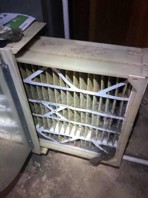 Performed scheduled maintenance visit on heating system, which included inspection of the furnace unit and ductwork. Discovered heavily soiled air filter with significant dust accumulation, indicating prolonged use since previous service (filter appeared dated 3-20-15). Replaced filter to restore proper airflow and system efficiency.