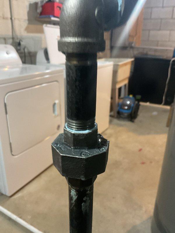 Performed scheduled heating maintenance service. Inspected gas pipe connections at the union fitting in the utility room and assessed for proper sealing. Used hex key tool to access and examine control board components of the heating system for proper function and electrical connectivity.