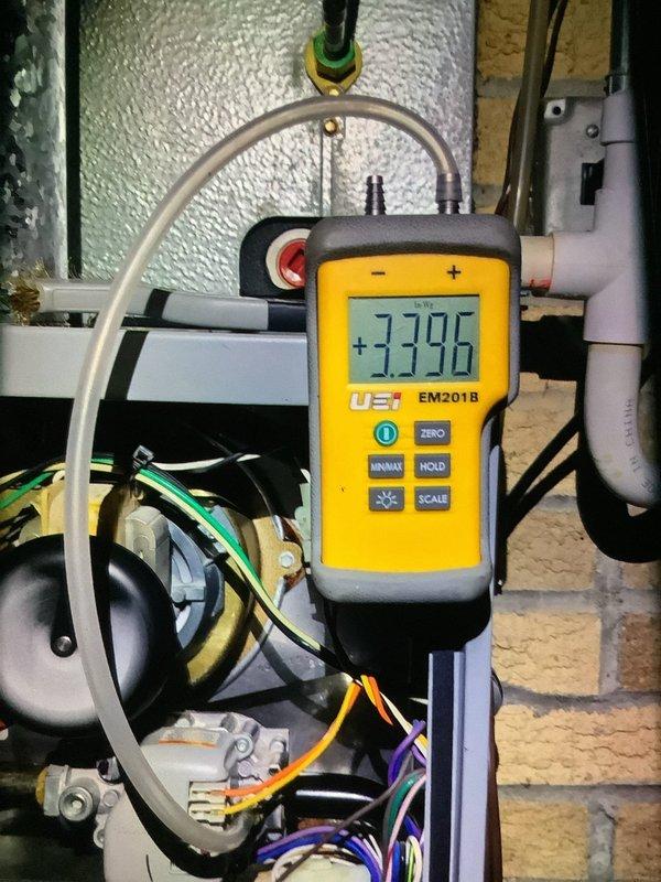 Performed scheduled MVP heating maintenance service. Inspected HVAC system and identified significant corrosion on internal components and metal housing. Conducted pressure testing with digital manometer (EM201B), obtaining reading of 3.396.