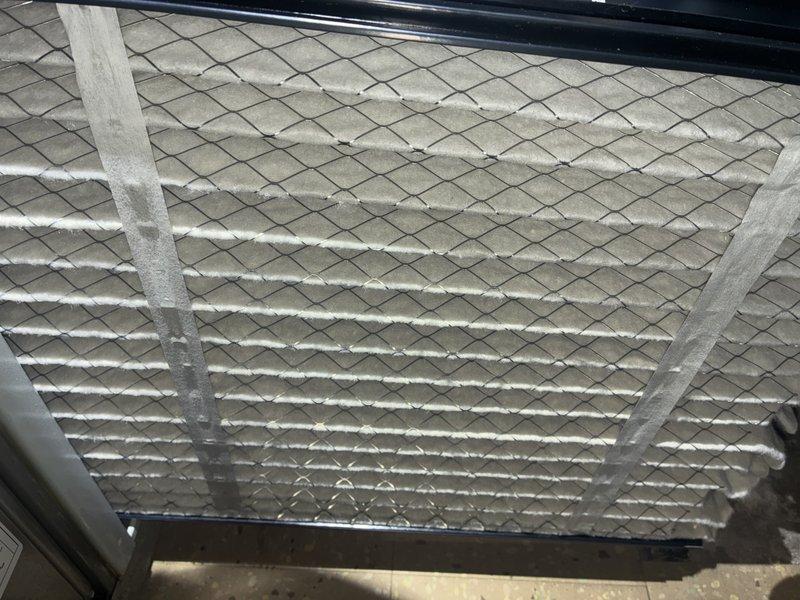Performed scheduled MVP heating maintenance service. Inspected air handling unit and filter, confirming filter is clean with no significant dust buildup and properly installed in frame with intact mesh support structure. Examined mechanical components including PVC piping and galvanized ductwork connections, all found to be in good functional condition with no signs of leaks or deterioration.