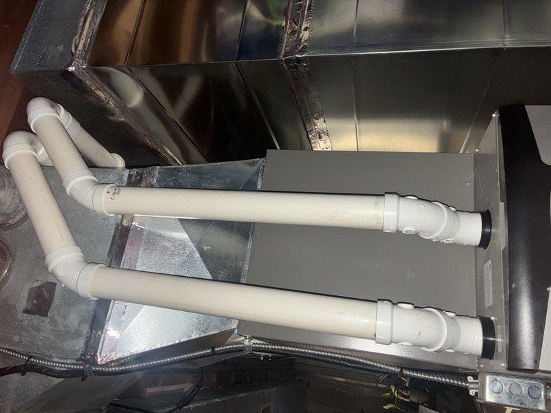Performed scheduled MVP heating maintenance service. Inspected air handling unit and filter, confirming filter is clean with no significant dust buildup and properly installed in frame with intact mesh support structure. Examined mechanical components including PVC piping and galvanized ductwork connections, all found to be in good functional condition with no signs of leaks or deterioration.