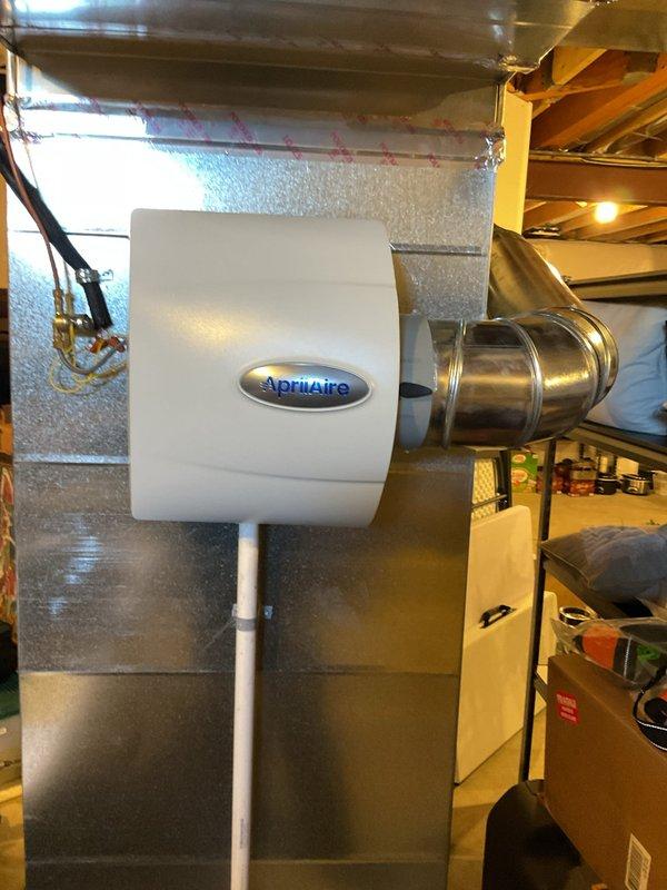 Diagnosed furnace intermittently blowing cold air after approximately 20 minutes of operation. Performed inspection of system components including circuit board, electrical connections, and ventilation. Examined Aprilaire humidifier installation and verified proper integration with HVAC system.