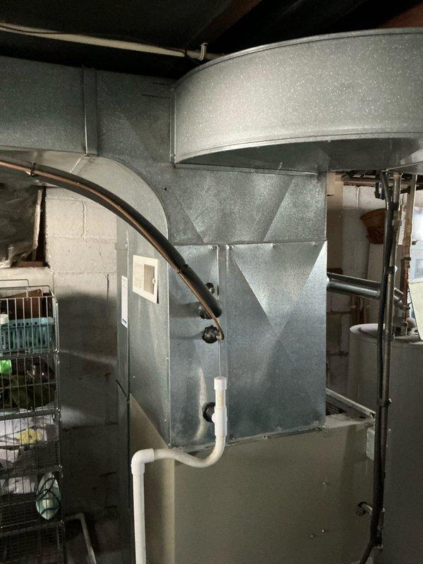 Performed inspection of 33-year-old heating system, documenting existing basement installation with significant age-related wear. Provided replacement estimate for new furnace system, including upgraded sheet metal ductwork, proper condensate drainage, and all necessary ventilation components.
