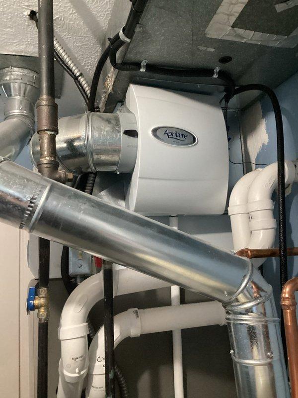 Performed routine maintenance on a 2-year-old gas furnace with MVP technology. Inspected the Aprilaire whole-home humidifier system, including all ductwork connections and associated plumbing components. Replaced pleated air filter which showed visible dust accumulation and documented system condition with photos for service records.