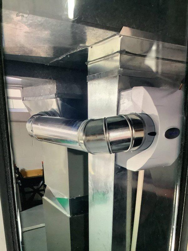 Responded to rolled service call regarding recently installed humidifier with low humidity levels. Inspected HVAC ductwork system and connections, finding proper installation of metal air ducts with cylindrical connector. Examined and verified condition of system filter and associated brass valve/fitting components, ensuring proper airflow for humidification system operation.