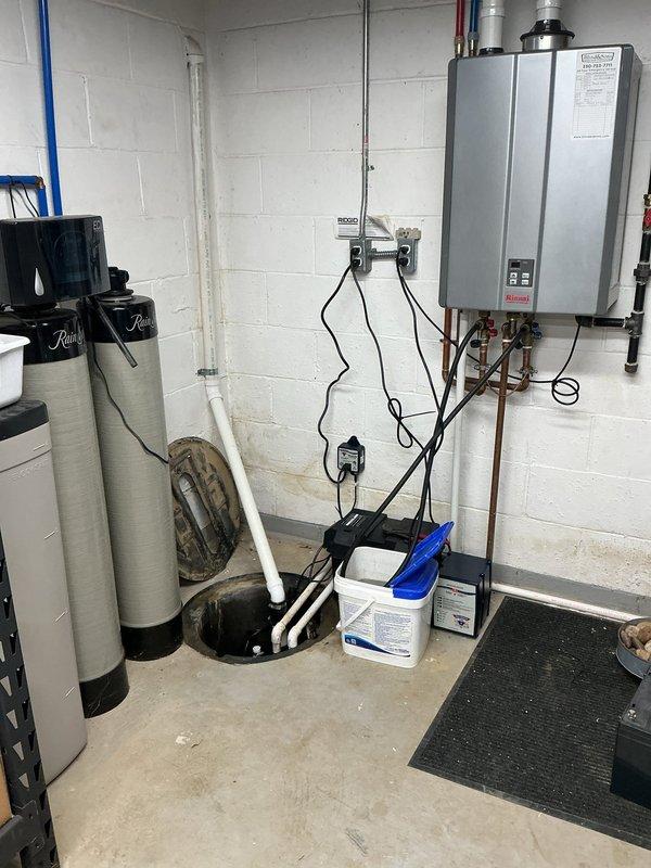 Completed replacement of battery backup system for sump pump installation in basement utility area. Removed old battery backup unit and installed new one, ensuring proper electrical connections to control box and sump pump system. Verified system operation with successful test cycle and documented installation with photos of completed work.