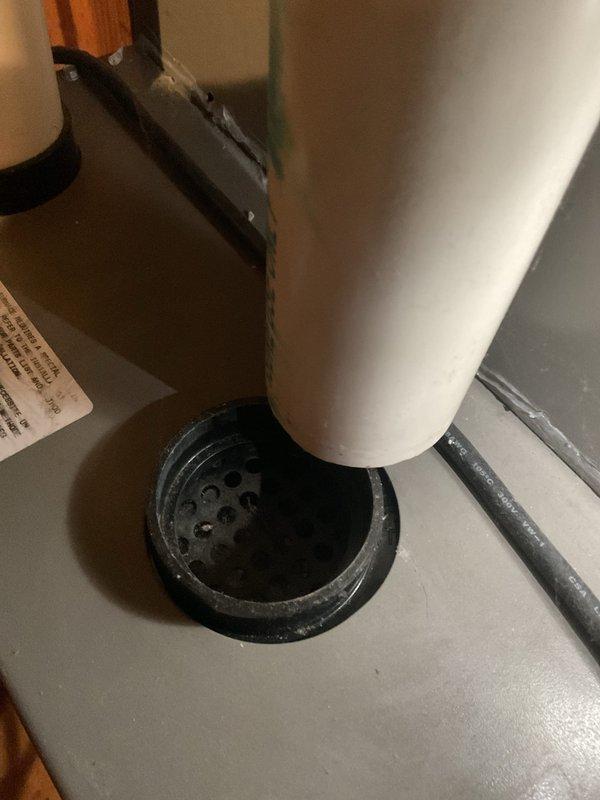 Performed routine maintenance on 3-year-old MVP gas furnace, including inspection of condensate drain system and examination of air intake components. Observed minor dust accumulation around drain base which was cleaned to ensure proper drainage function, and verified integrity of protective mesh covering on ventilation system.