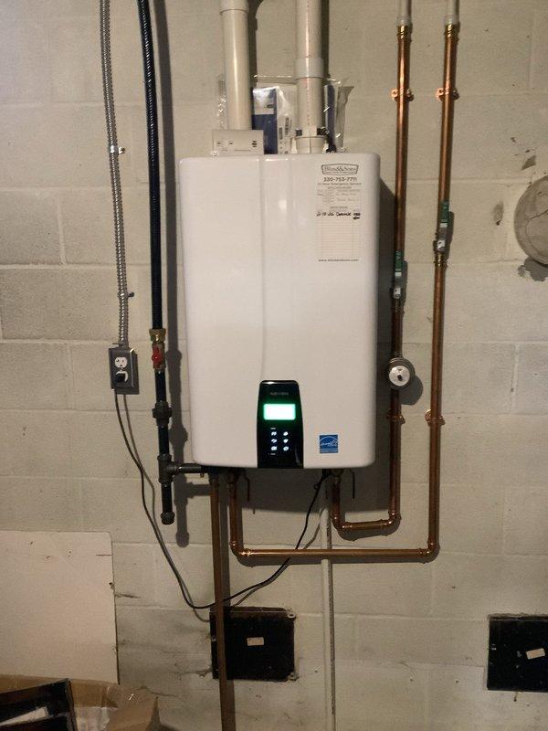 Performed descaling service on a 1-year-old Navien tankless water heater to remove mineral buildup and ensure optimal performance. Inspected the complete water treatment system including the Ionics water softener and associated plumbing. System is now operating efficiently with improved flow rate and heating capability.