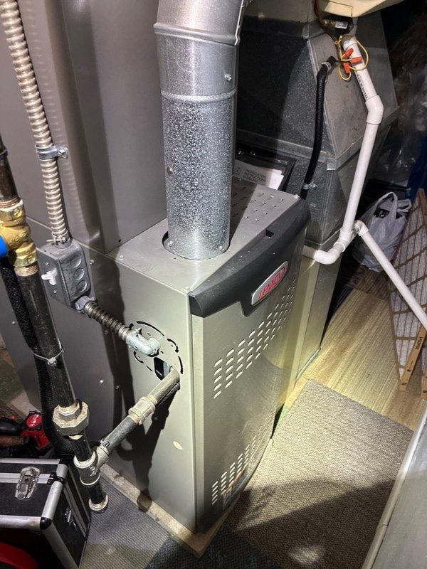 Performed scheduled MVP heating maintenance service at 8am as confirmed. Inspected furnace system including control board circuitry and connections. Observed condensation on ductwork and examined all visible components including PVC venting, copper lines, and valve assemblies to ensure proper operation and safety compliance.