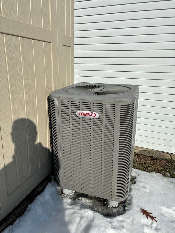 Performed routine maintenance on 14-year-old Lennox heat pump system. Inspected outdoor condenser unit and evaporator coil assembly in air handler. System is functioning within normal parameters despite age; recommended continued regular maintenance to extend remaining service life.