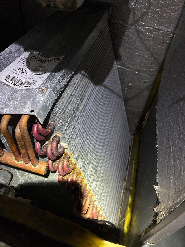Performed routine maintenance on 14-year-old Lennox heat pump system. Inspected outdoor condenser unit and evaporator coil assembly in air handler. System is functioning within normal parameters despite age; recommended continued regular maintenance to extend remaining service life.