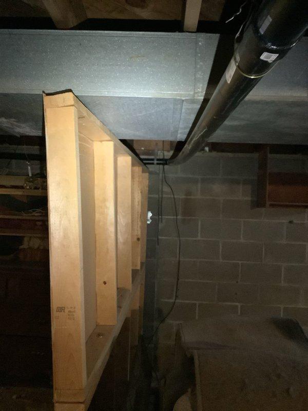 Responded to service call for suspected broken drain pipe beneath concrete in 70-year-old residence. Upon inspection of basement utility area, conducted thorough assessment of the plumbing system including cast iron drain pipes and connections. Identified source of issue at junction point where deterioration had occurred due to age, creating subsurface leakage affecting foundation. Implemented repair solution using appropriate materials compatible with existing plumbing infrastructure.