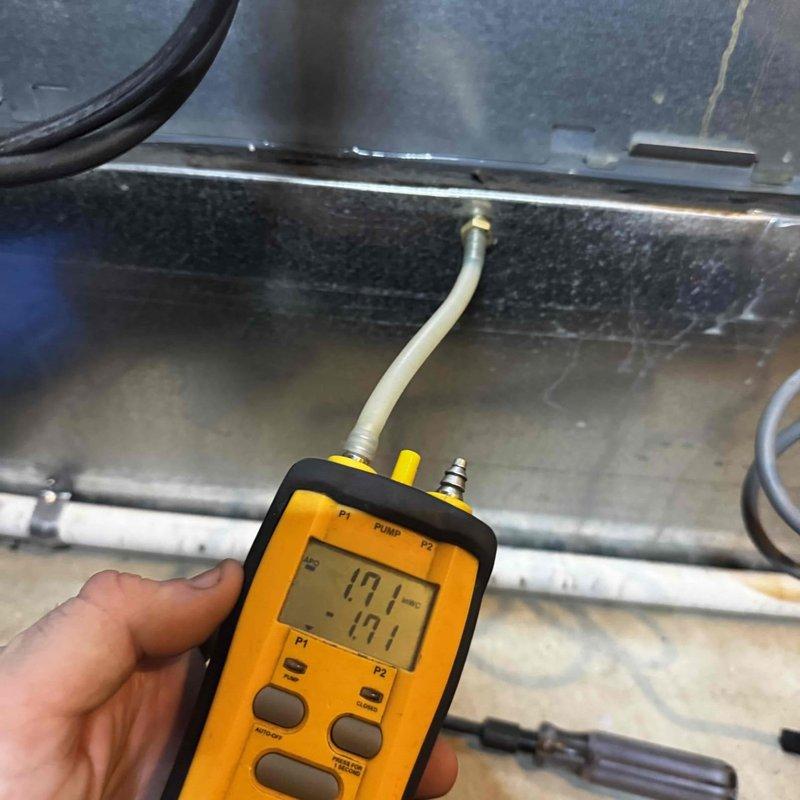 Performed routine maintenance on heating system including pressure testing with digital gauge (readings: 17.1/-17.1). Inspected tankless water heater installation and associated components including expansion tank, copper piping, and gas line connections. Customer renewed maintenance plan; payment collected as agreed.