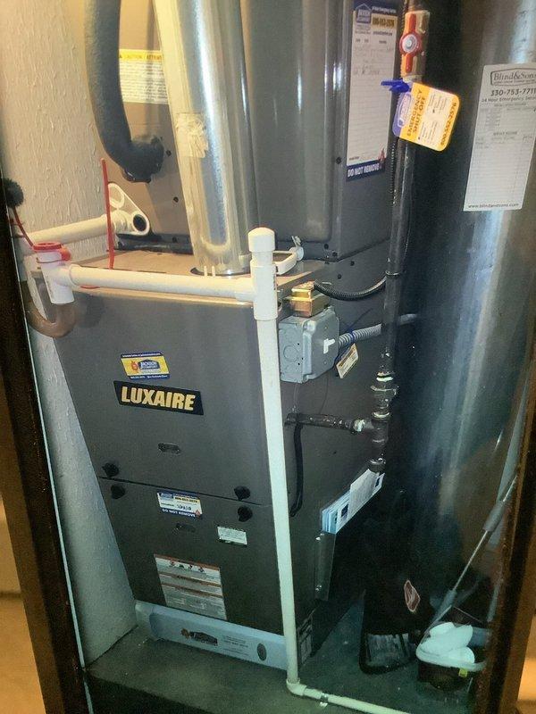 Performed monthly maintenance on 7-year-old Luxaire cooling system. Inspected evaporator coils which showed signs of frost accumulation at connection points, indicating potential refrigerant flow issues. Verified system operation and discussed with customer about dual heating/cooling functionality of their equipment.