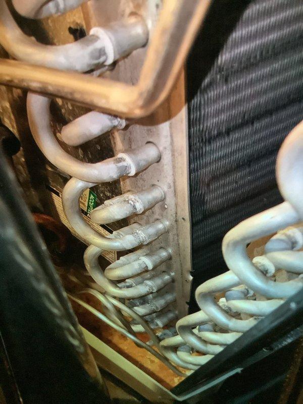 Performed monthly maintenance on 7-year-old Luxaire cooling system. Inspected evaporator coils which showed signs of frost accumulation at connection points, indicating potential refrigerant flow issues. Verified system operation and discussed with customer about dual heating/cooling functionality of their equipment.