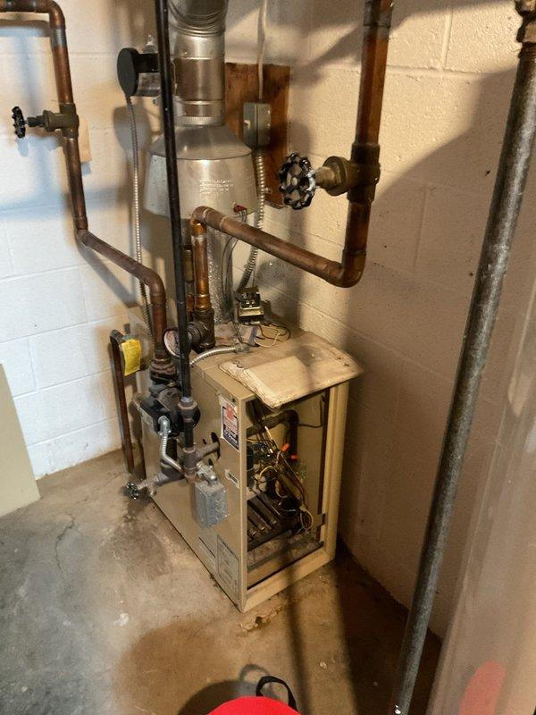 Diagnosed and repaired 15-year-old furnace that had completely ceased heating function. Inspection revealed failed ignition sequence due to deteriorated flame sensor, which was cleaned and recalibrated. Additionally replaced worn draft inducer motor that was preventing proper ventilation, restoring full heating functionality to the aging system.