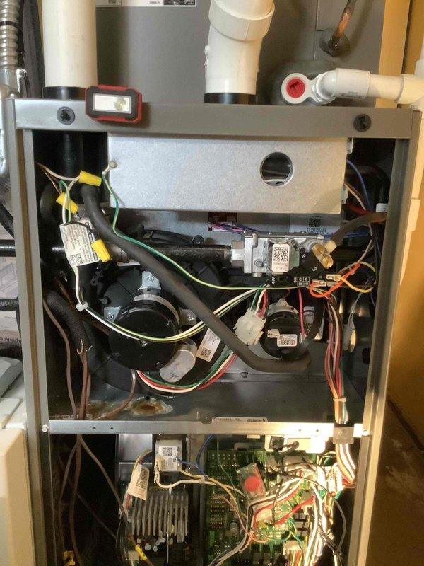 Performed routine MVP furnace maintenance service, inspecting the control board and electrical connections. Examined interior components including circuit boards, wiring harnesses, and blower assembly. All systems functioning properly with no issues identified during the service visit.