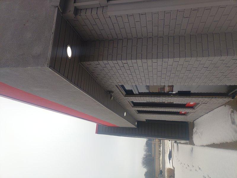 Conducted comprehensive electrical inspection of commercial property with focus on car charging station infrastructure. Documented existing electrical systems through photographic assessment of both exterior and interior spaces, including ceiling-mounted fixtures and available power distribution points. All inspection requirements from provided checklist were completed and documented according to specifications.
