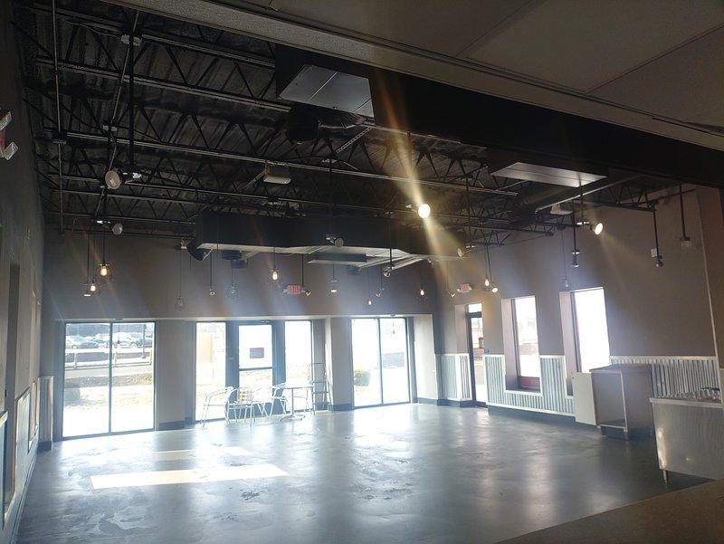 Conducted comprehensive electrical inspection of commercial property with focus on car charging station infrastructure. Documented existing electrical systems through photographic assessment of both exterior and interior spaces, including ceiling-mounted fixtures and available power distribution points. All inspection requirements from provided checklist were completed and documented according to specifications.