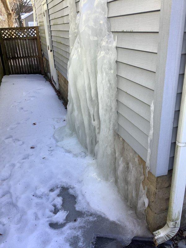 Replaced two straight stops as requested. Observed significant ice formation on exterior wall extending 3-4 feet upward from foundation, indicating potential water leakage issues. Also noted possible water staining beneath window frame with gap at sill that could permit infiltration.