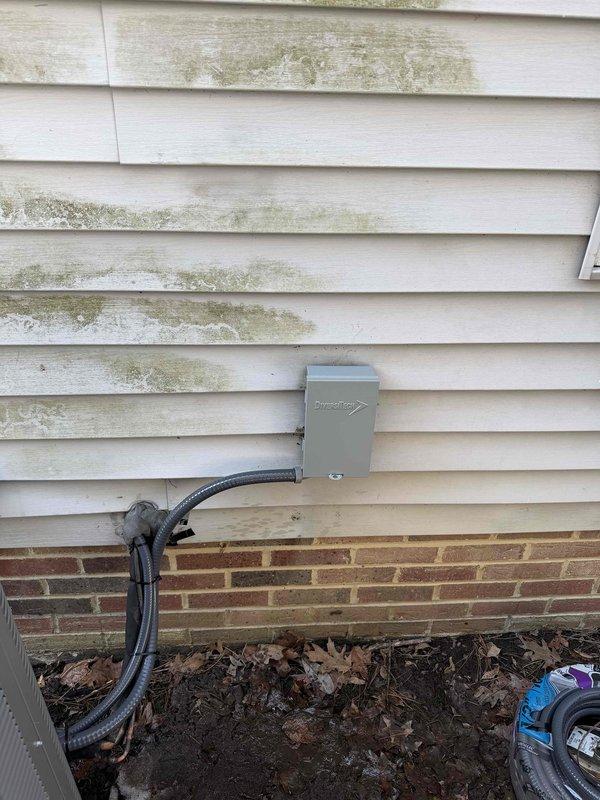 Completed full system installation at residence with existing mold issues on exterior siding. Performed temperature diagnostics during startup, confirming proper system operation with readings of 699°F at the furnace exhaust. Installed new electrical connections including junction box mounted on exterior wall with appropriate conduit.