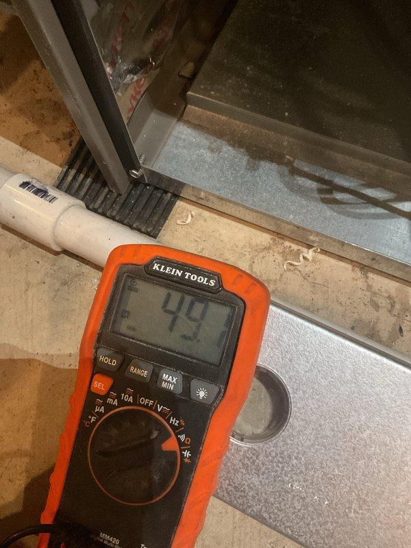 Performed scheduled MVP Heating maintenance visit with comprehensive electrical diagnostics. Conducted voltage testing using Klein Tools multimeter showing 49V reading at metal frame connection point, and verified system temperature parameters with UEi EM720 device registering 60.4°F. All measurements within normal operating range for heating system.