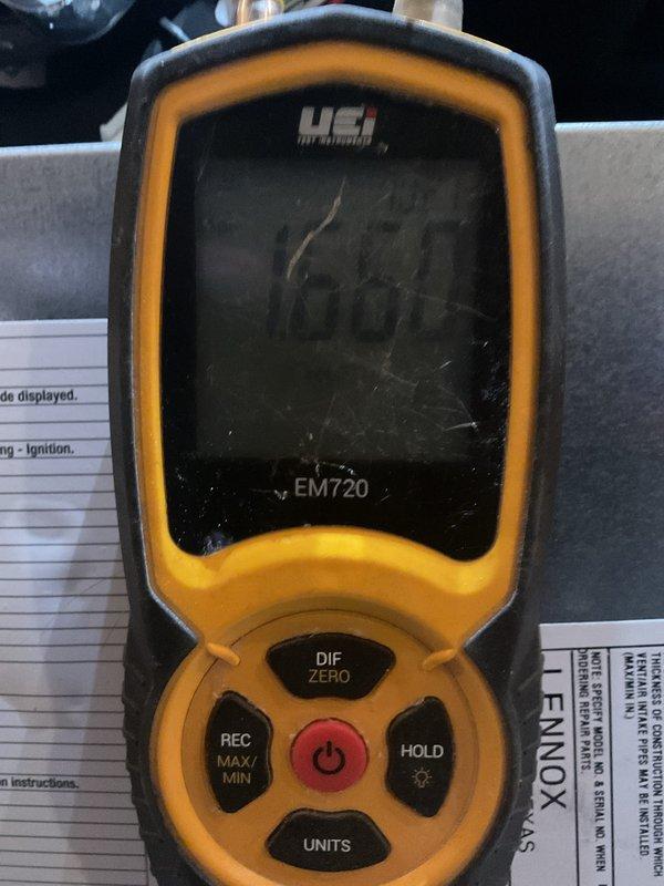 Performed scheduled MVP Heating maintenance visit with comprehensive electrical diagnostics. Conducted voltage testing using Klein Tools multimeter showing 49V reading at metal frame connection point, and verified system temperature parameters with UEi EM720 device registering 60.4°F. All measurements within normal operating range for heating system.