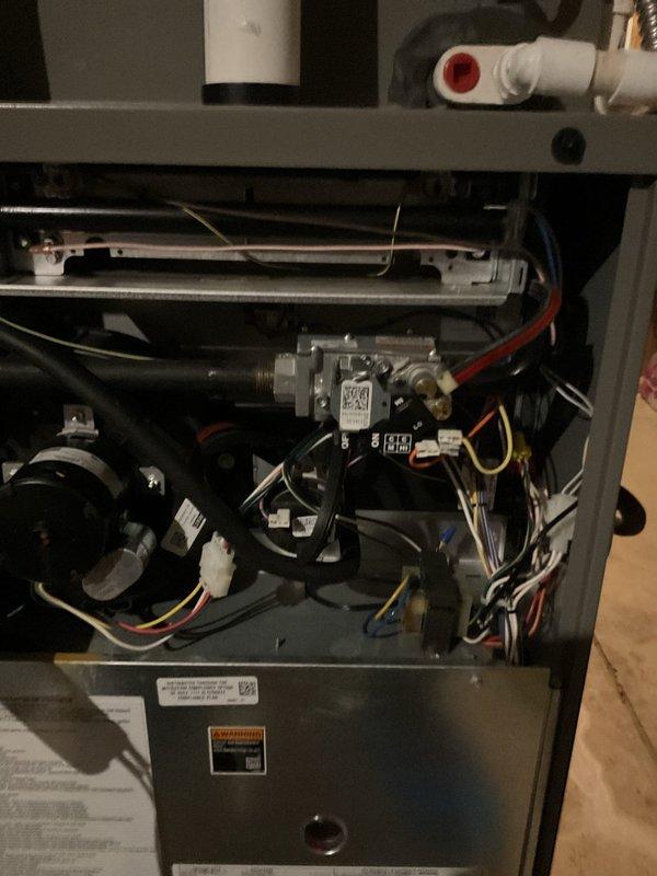 Diagnosed and confirmed internal gas leak in 4-year-old furnace, validating utility company's initial findings. Performed comprehensive inspection of gas valve, connections, and control components, documenting condition with detailed photos of internal system components.