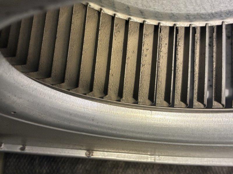 Performed scheduled furnace tune-up, inspecting system components and operation. Noted significant dust accumulation on blower wheel requiring cleaning to improve airflow efficiency. Utilized hex key tool to access and service internal components during maintenance procedure.