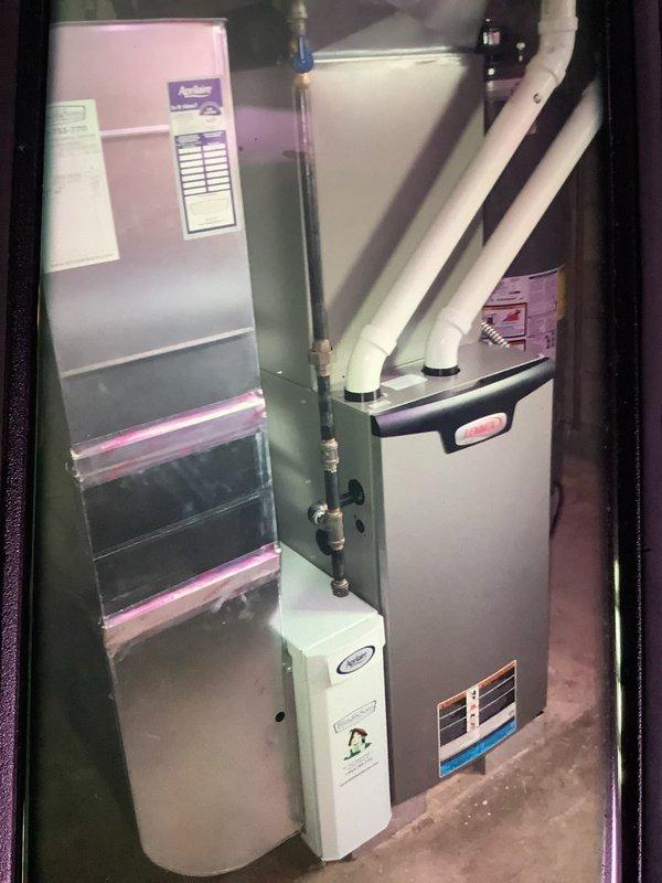 Completed biannual MVP heating maintenance service on 2-year-old system. Inspected furnace and air handler components, including examination of the control board and electrical connections. Noted exterior exhaust cover panel is broken and requires replacement. System is otherwise functioning properly with all connections secure.
