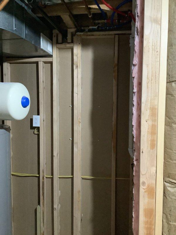 Arrived at customer site to perform electrical rewiring for a tankless water heater installation. Completed wiring connections in the utility room where construction was in progress with exposed framing and insulation. Conducted electrical testing using Klein Tools device which confirmed proper voltage (12.1) and correct wiring configuration at the outlet that will service the new unit.