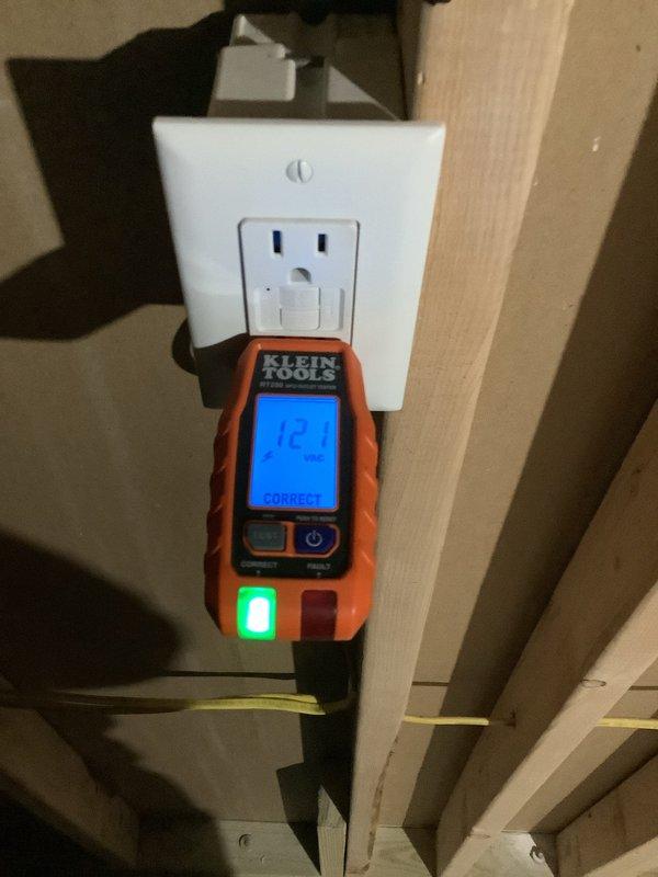 Arrived at customer site to perform electrical rewiring for a tankless water heater installation. Completed wiring connections in the utility room where construction was in progress with exposed framing and insulation. Conducted electrical testing using Klein Tools device which confirmed proper voltage (12.1) and correct wiring configuration at the outlet that will service the new unit.