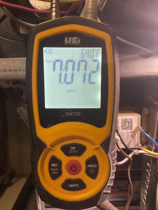 Performed routine MVP heating maintenance service on 3-year-old system. Conducted temperature and pressure measurements using UEi EM720 digital meter (recorded 84.0°F temperature and 0.072 inH2O pressure). Verified electrical parameters with Klein Tools multimeter showing 49.2 reading. System appears to be operating with staggered performance; customer advised about MVP renewal.