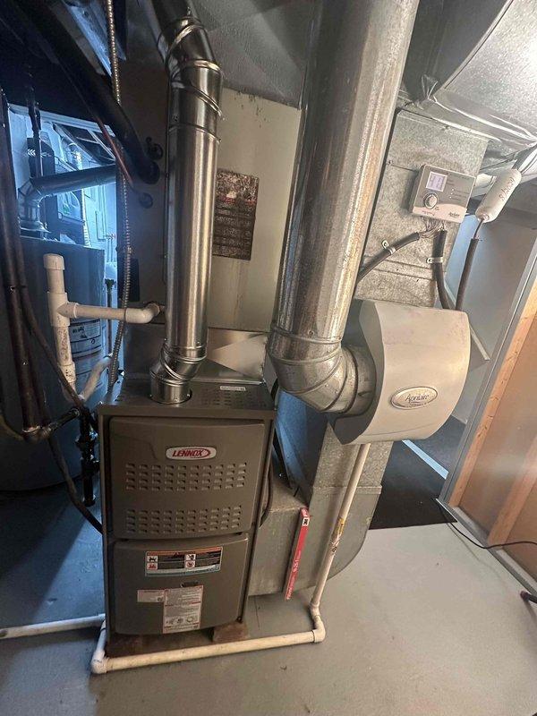 Successfully installed a new Lennox furnace unit in the basement, including proper connection of all metal ductwork components and integration with the existing Aprilaire humidifier system. Completed installation with appropriate PVC drainage piping and verified system functionality before concluding the first stage of the job.