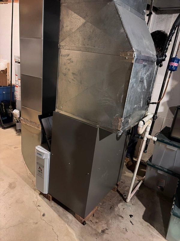 Completed installation of an 80% efficiency furnace in basement utility room. Installed new metal ductwork with proper connections to existing distribution system. System includes PVC drain lines and all required safety components, with final inspection confirming proper operation.