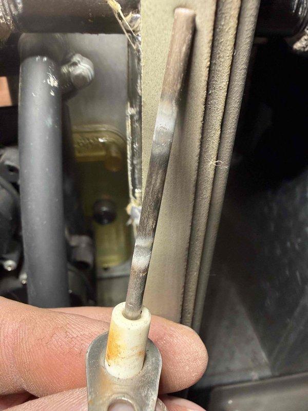 Performed routine BS-MVP heating maintenance visit. Inspected igniter assembly, noting some discoloration and wear on the igniter rod. Examined and verified proper positioning of igniter in ceramic bushing to ensure reliable system operation.